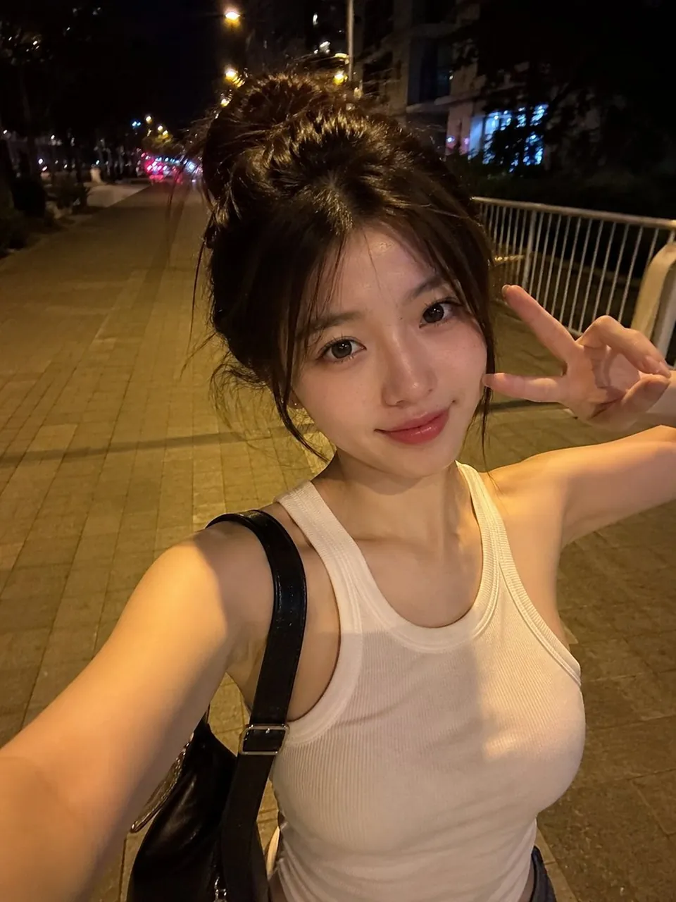 Realistic smartphone selfie of a beautiful young East Asian woman