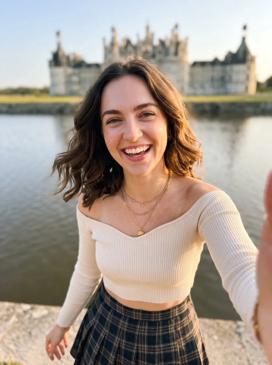 Selfie-style photo, young woman with wavy brown bob, warm golden