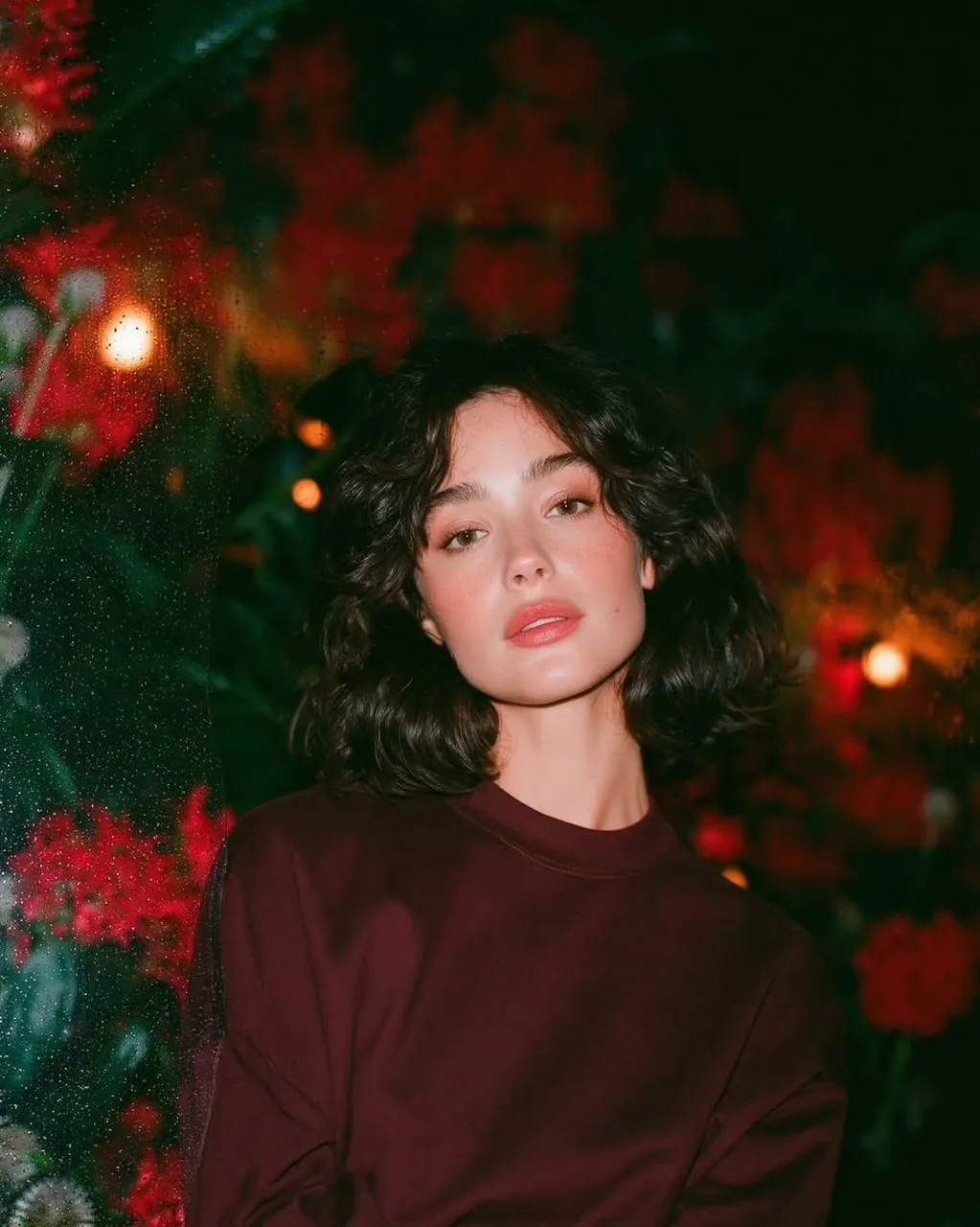 Dreamy cinematic nighttime portrait of a beautiful young woman