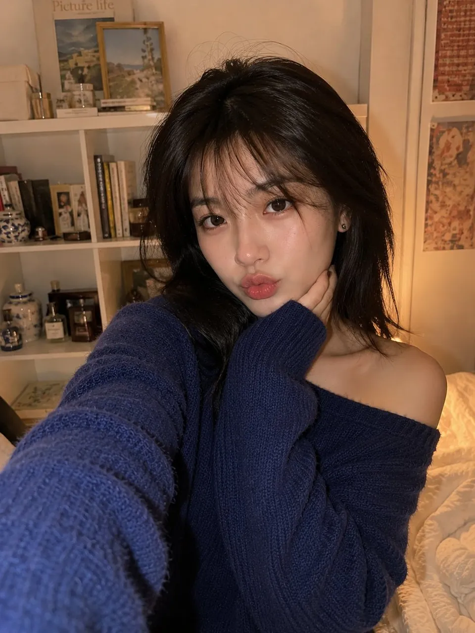 Smartphone selfie of a beautiful young East Asian woman indoors in